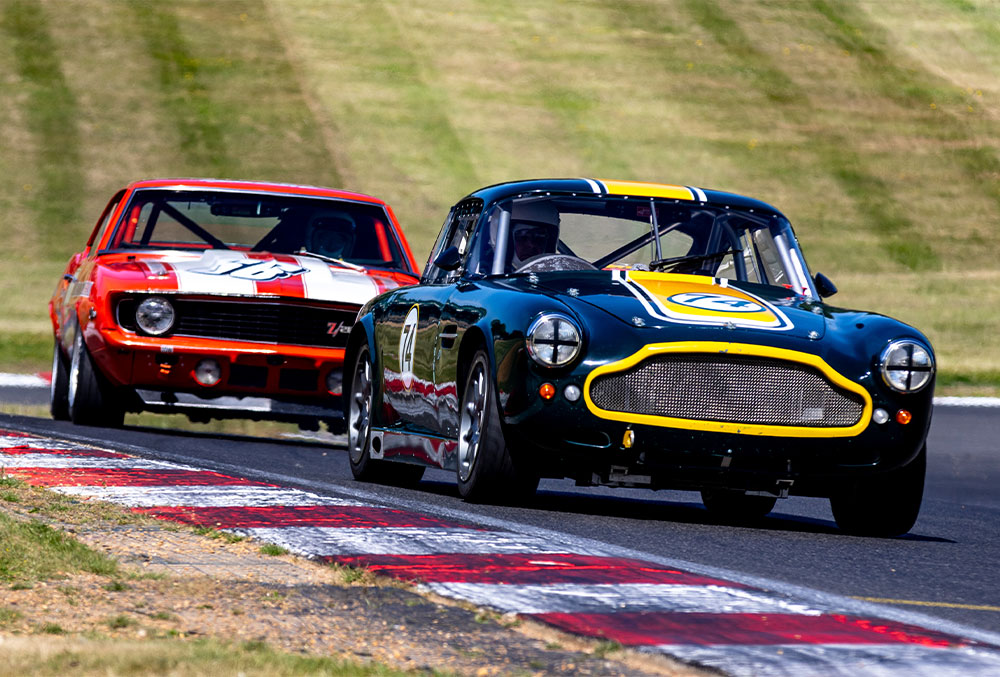 A photo of 2 cars racing at Brands Hatch GP